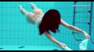 Sexy chick in the pool naked and horny big tits